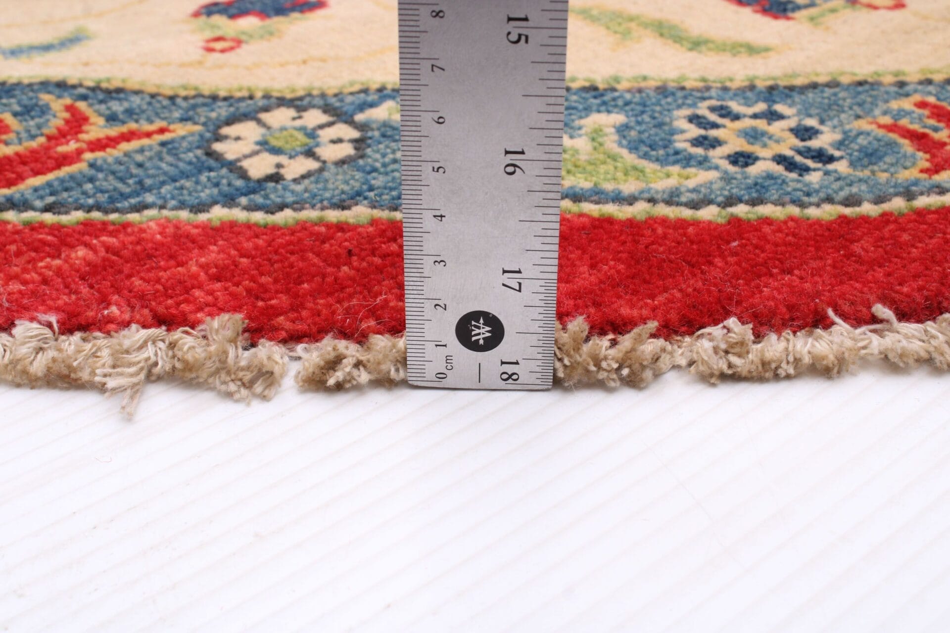 Een vloerkleed is een liniaal waarmee je de lengte van een tapijt kunt meten.