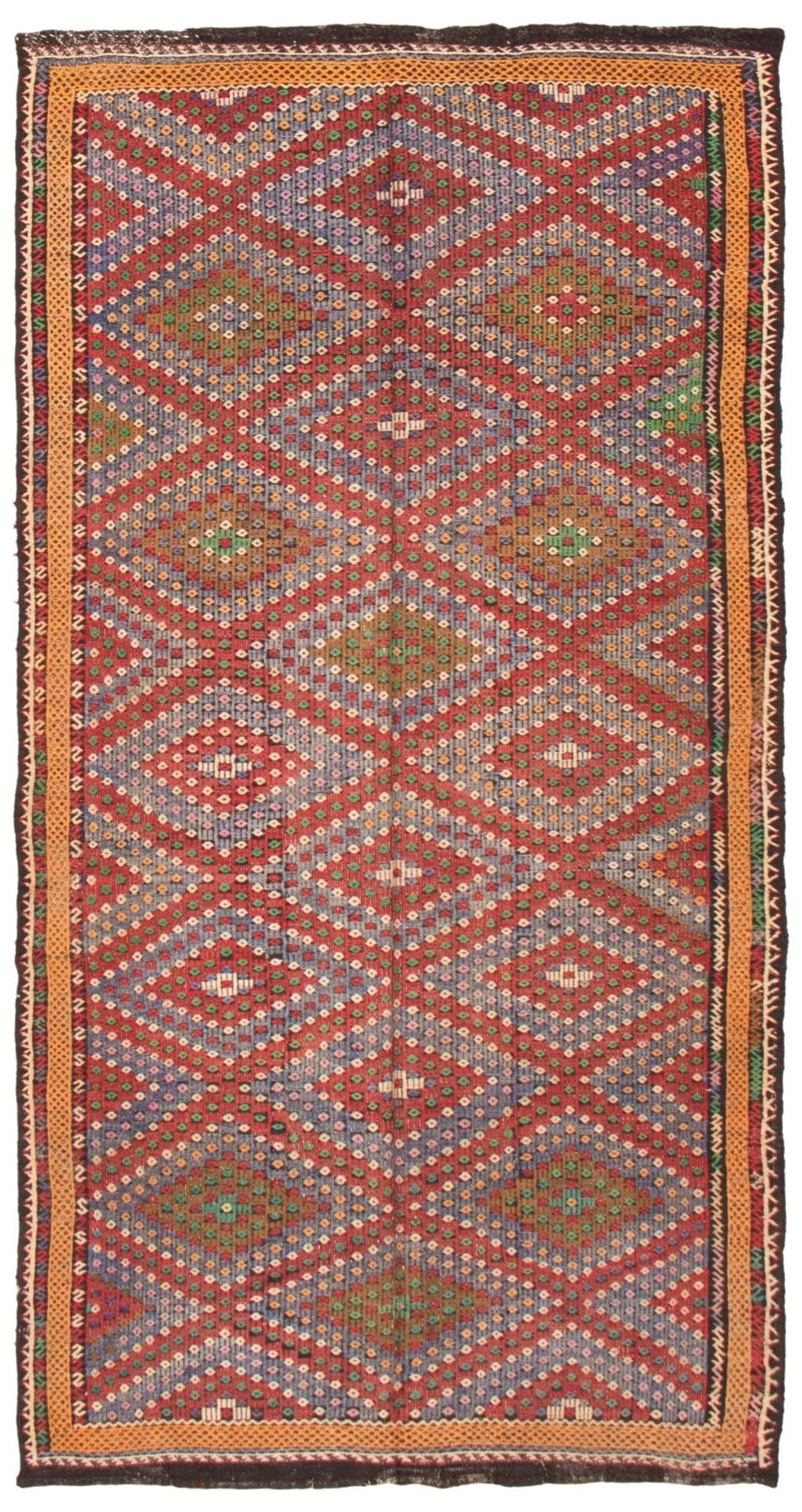 Een Turkse Konya platgeweven wollen kelim, van 183 x 348 cm, met een gedetailleerd geometrisch patroon in de kleuren rood, blauw, groen en oranje.