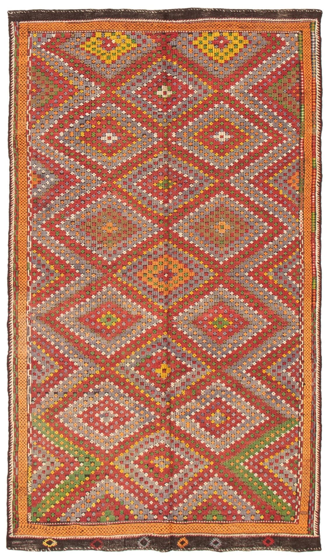 Een rechthoekige "Turks Konya plat geweven wollen wandtapijt kelim" van 183 x 325 cm heeft een ingewikkeld geometrisch patroon met ruitvormen in verschillende kleuren, waaronder oranje, rood, geel en groen. Dit vloerkleed heeft een mix van heldere en gedempte tinten.